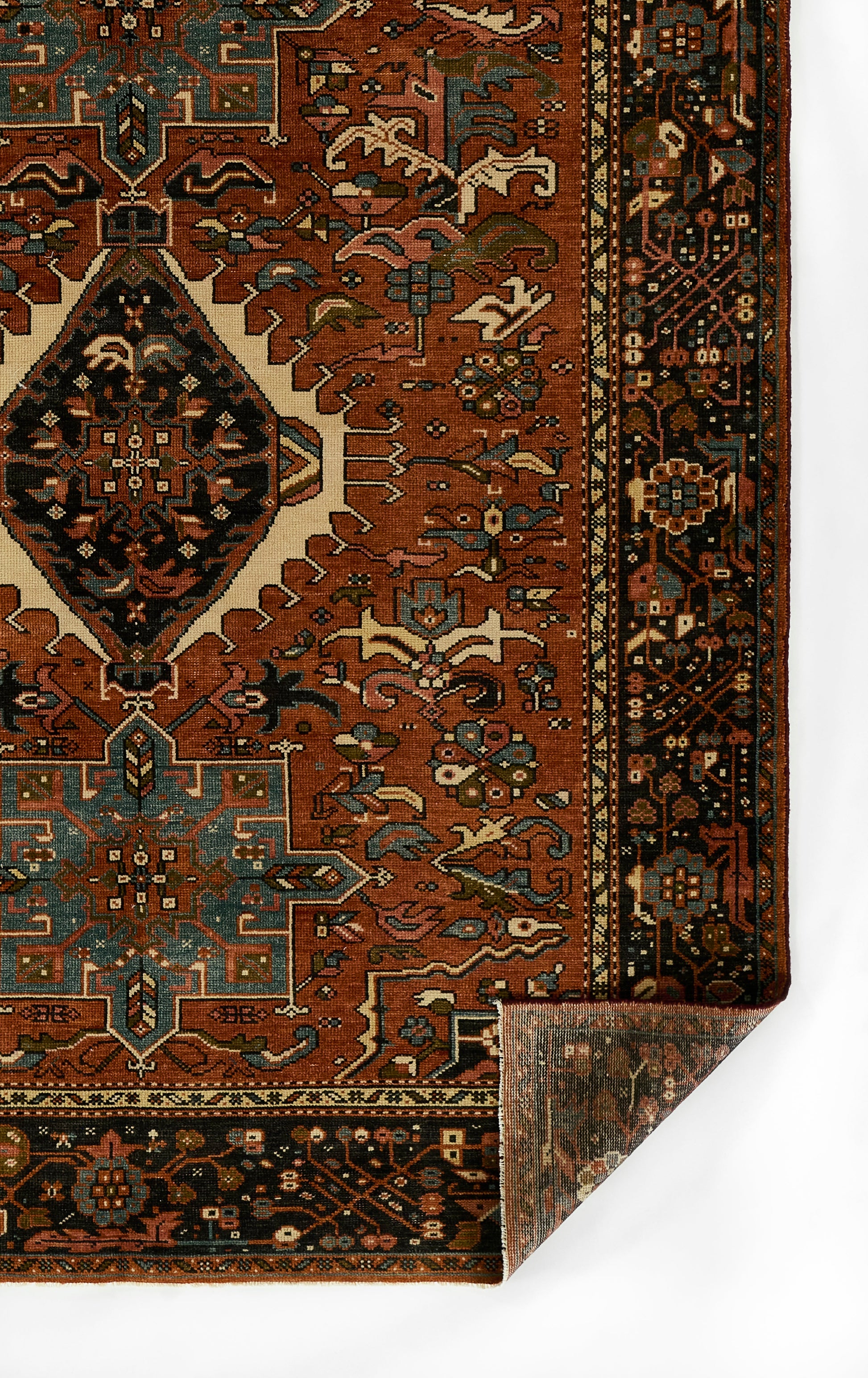 Red Karaj rug with teal and ivory geometric medallion, ornate dark border; Persian-inspired geometric design.