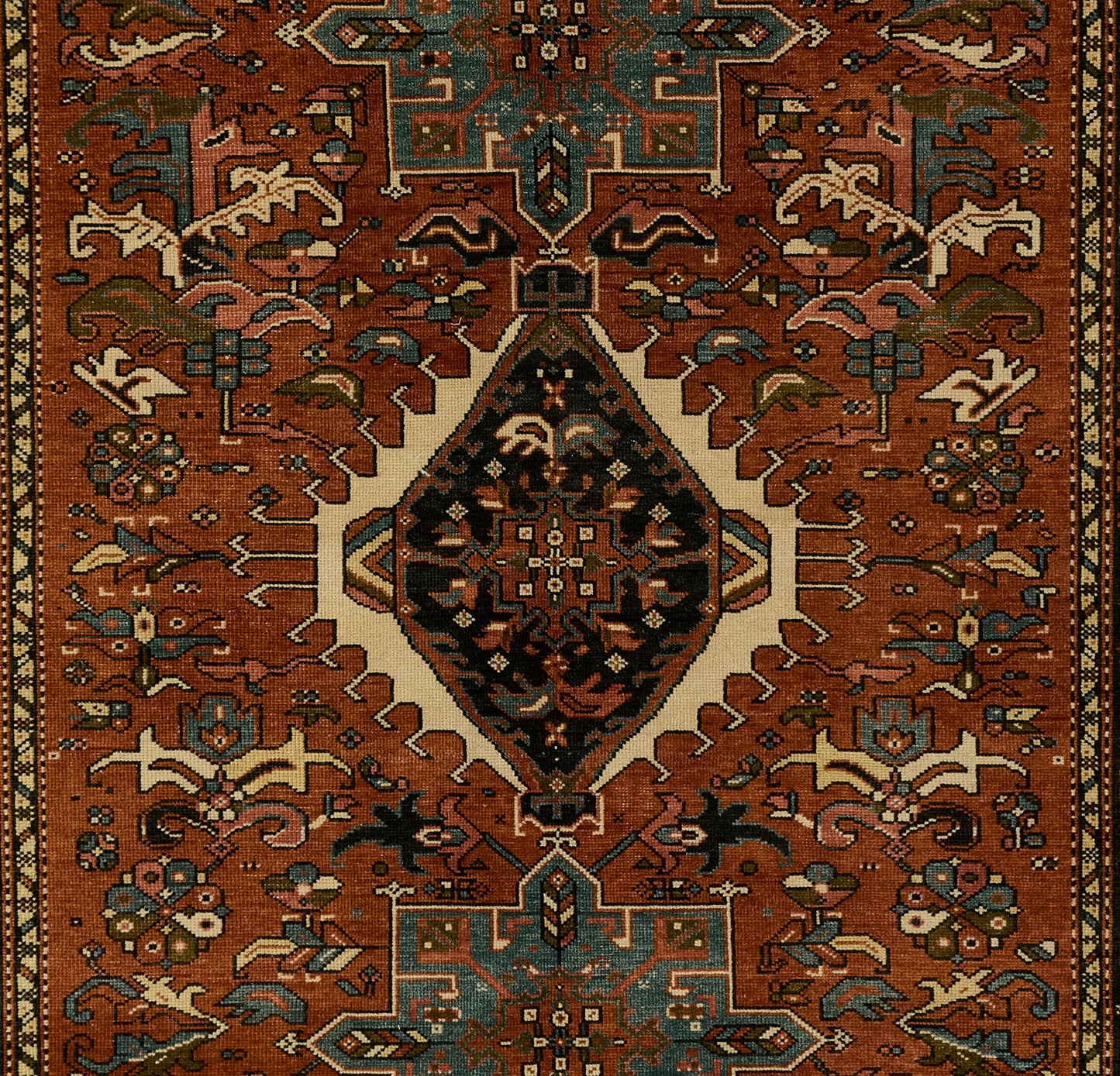 Karajkaj rug with rust-red field, central diamond medallion, teal and ivory accents; ornate geometric floral border.