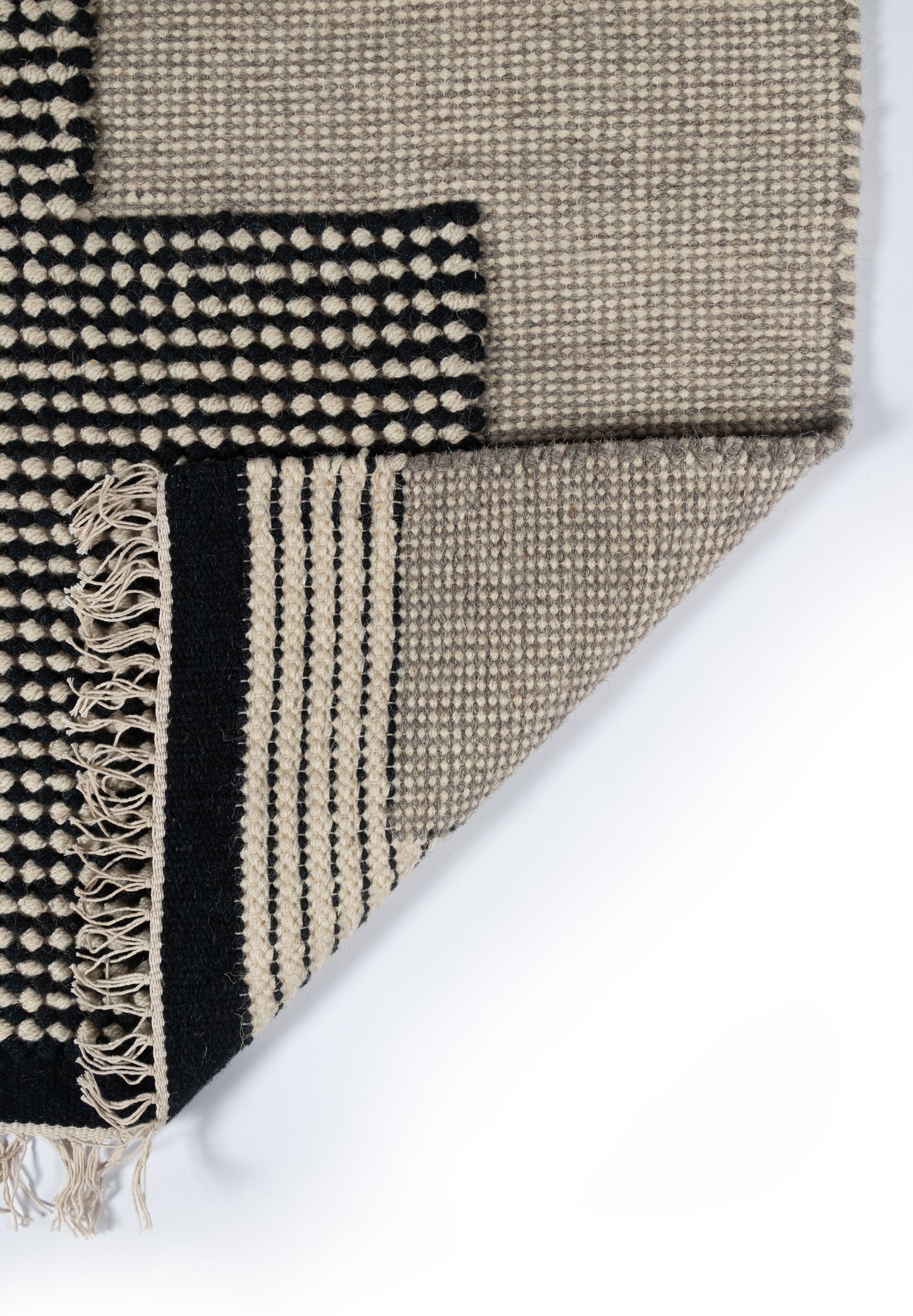 Beige and black geometric woven runner rug with fringed edge; rectangular modern living-room rug 2' x 8'.