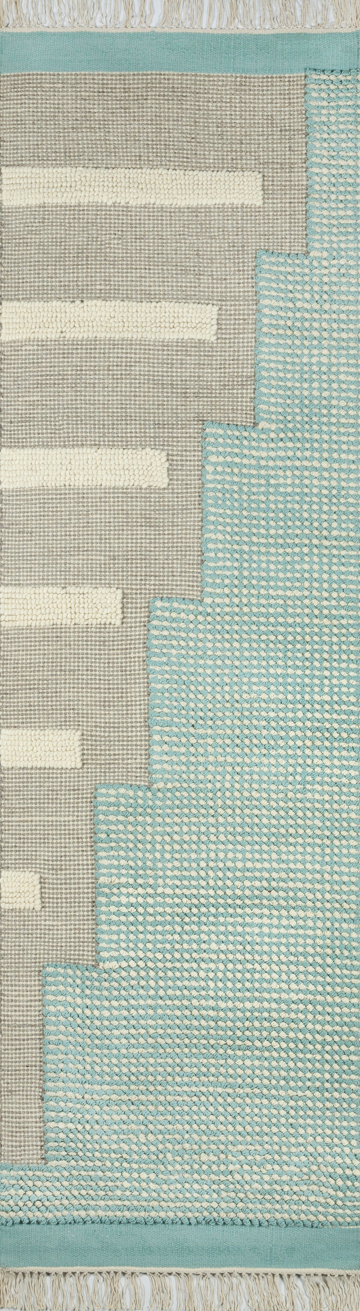 Woven area rug with beige field, white rectangular stripes, blue stepped edge and turquoise border; modern geometric.