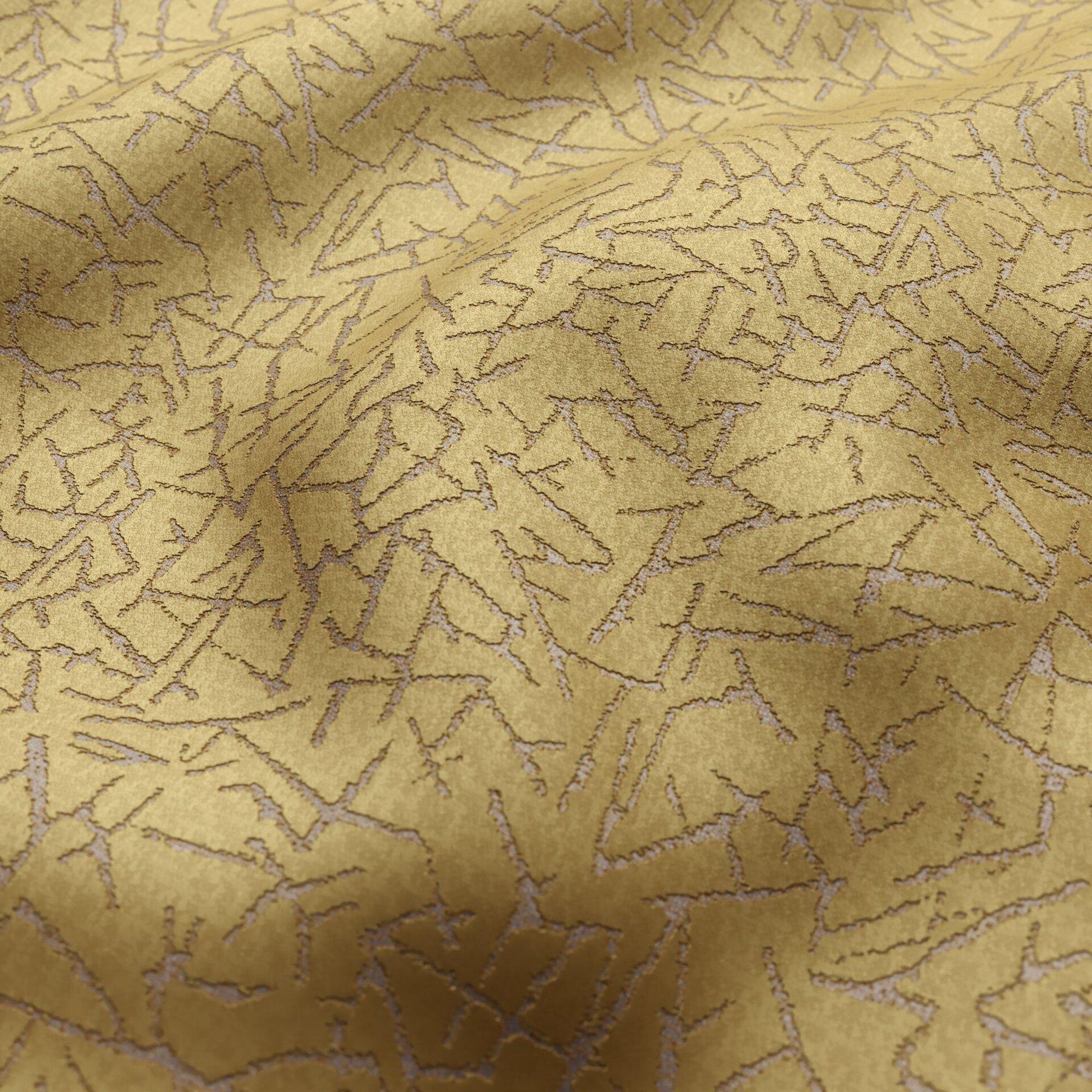 Gold fabric with abstract jagged shard pattern and subtle metallic texture, silver accents.