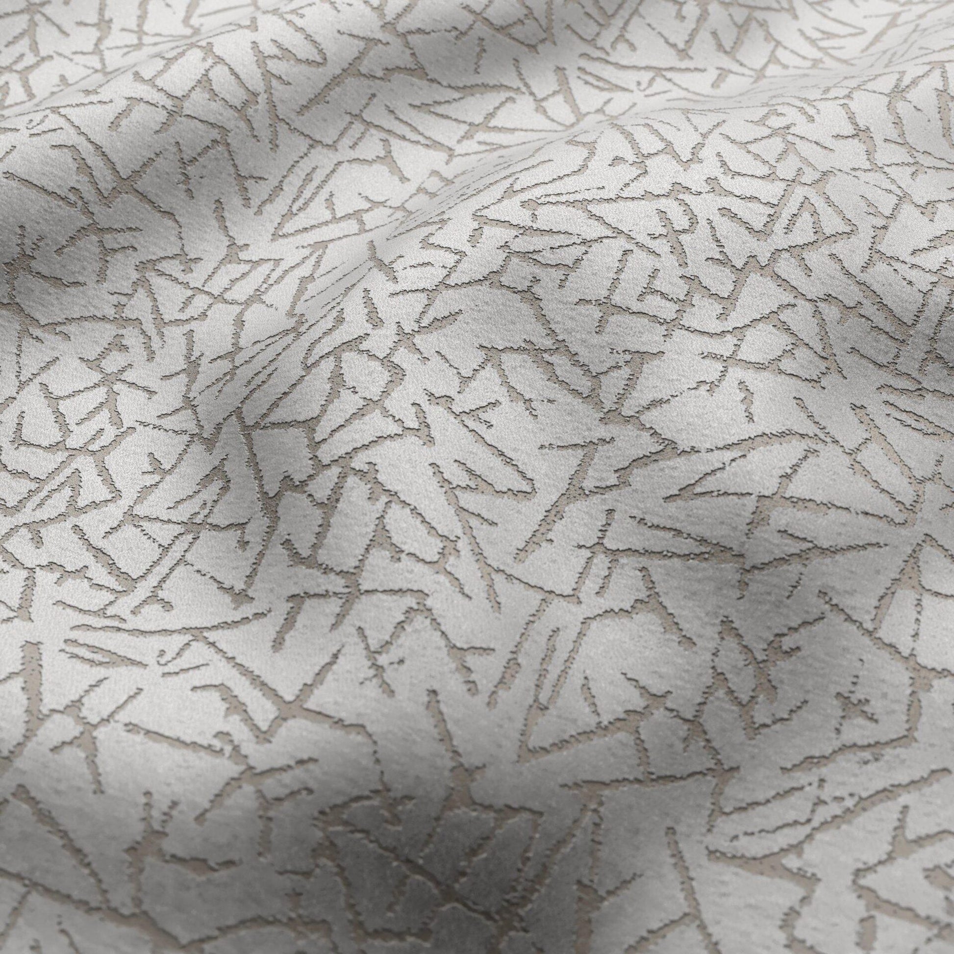 Light grey velvet fabric with an abstract silver pattern; soft, textured material suitable for upholstery or drapery.