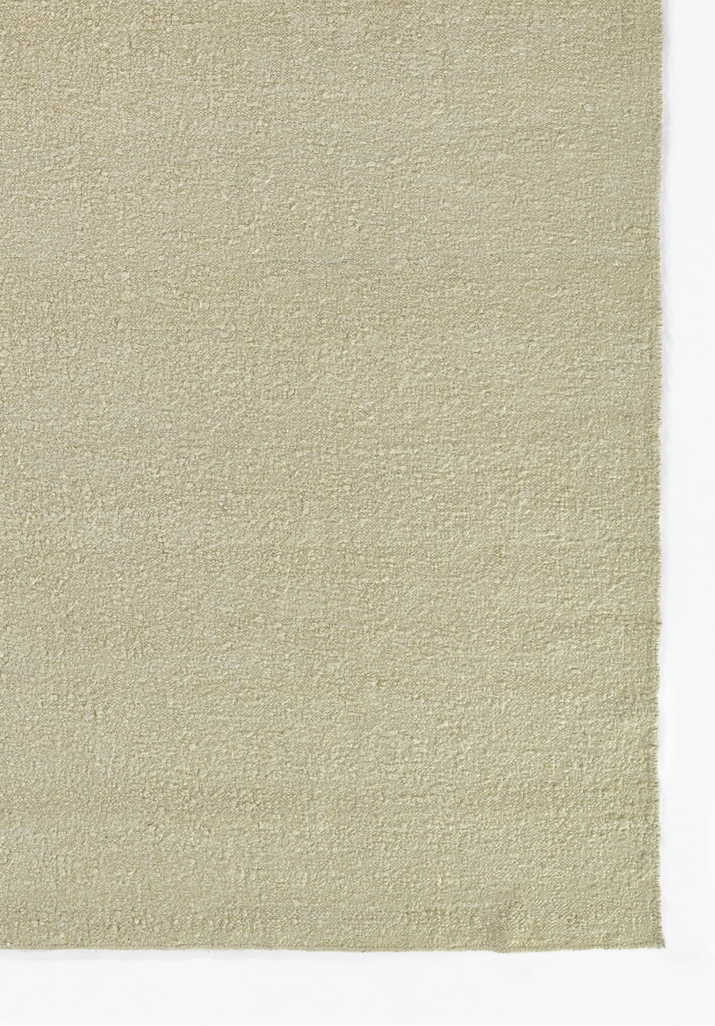 Beige textured rug sample with soft loop pile; rectangular swatch on white background.