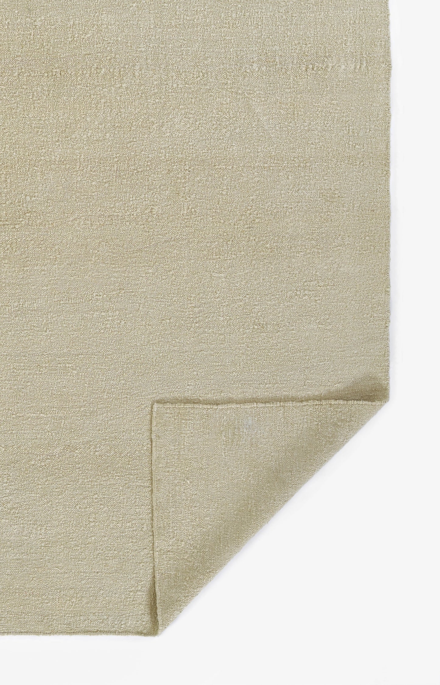 Beige boucle-textured fabric with a folded corner; plush-look material suitable for rug or towel.