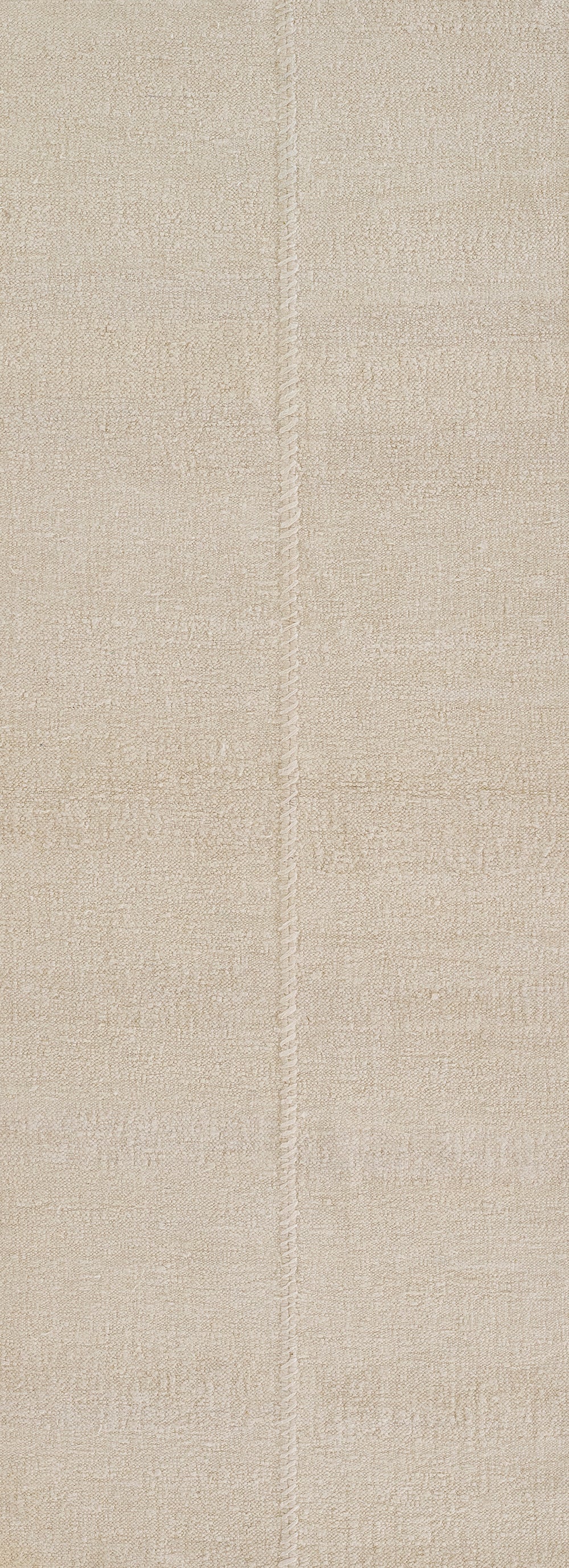 Beige textured area rug with vertical seam panel design; soft woven pile, neutral ivory tan shade, versatile living room rug.