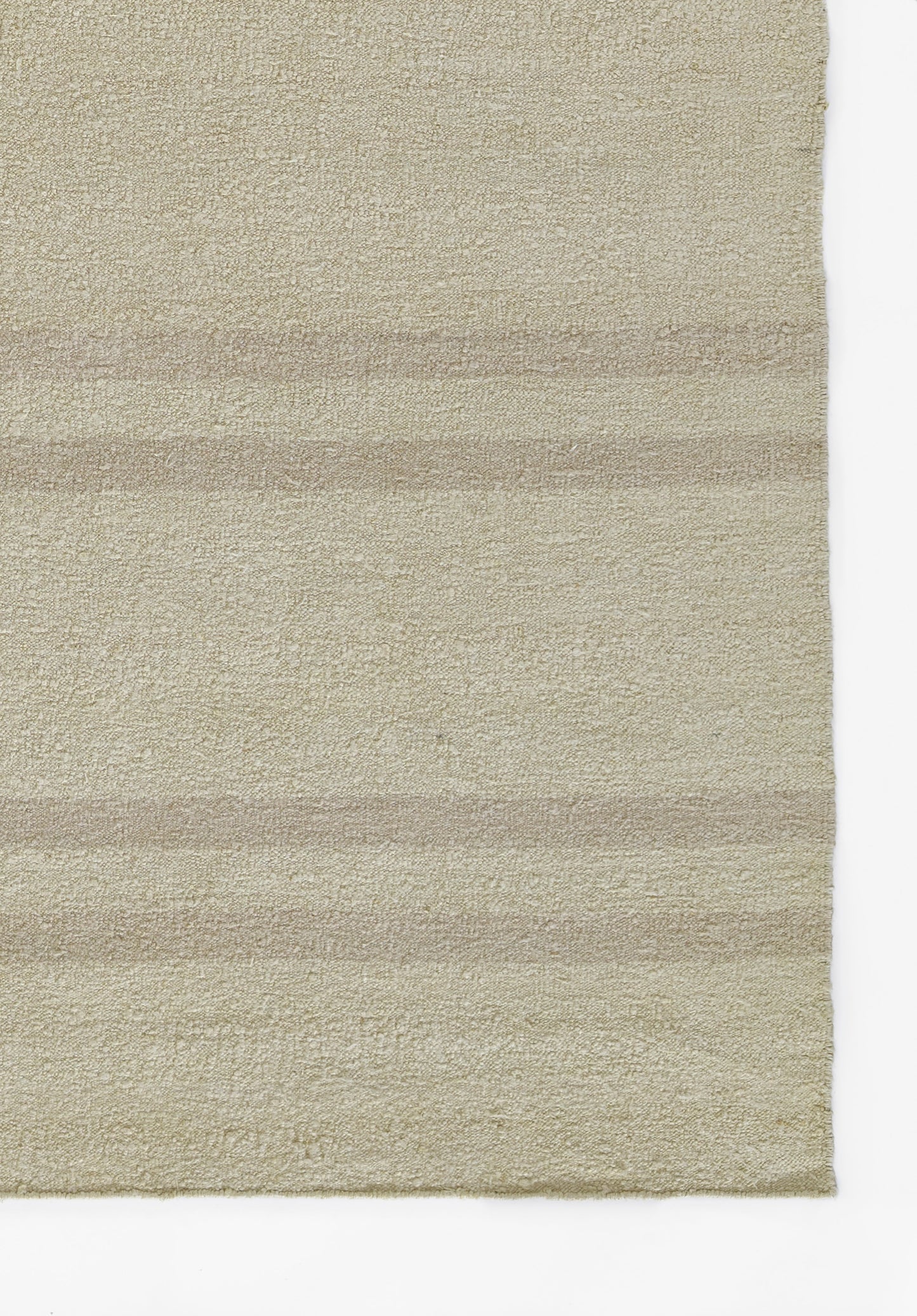Beige textured rug with subtle horizontal stripes and plush loop pile in cream-tan tones.