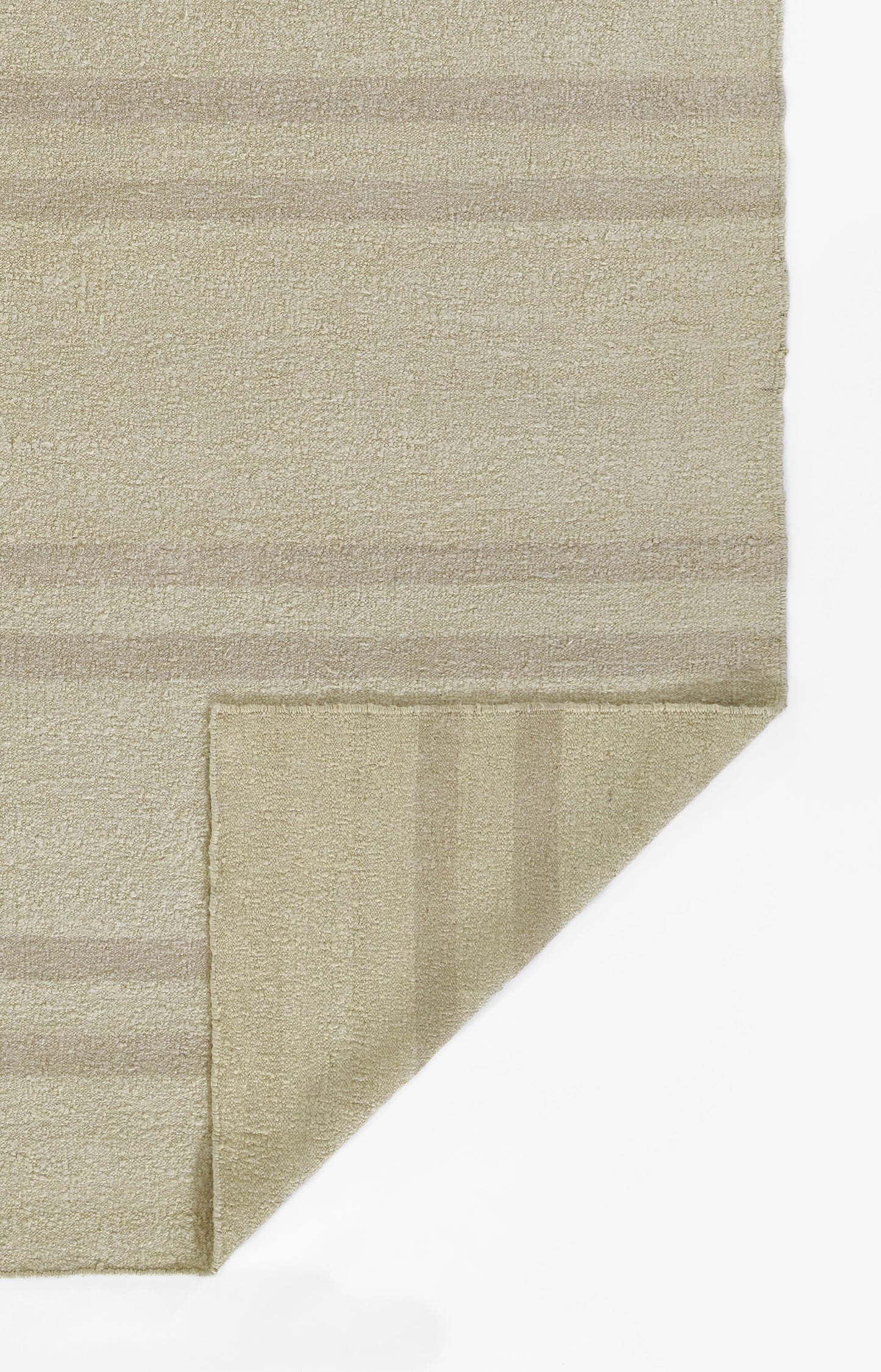 Beige textured rug with soft boucle pile and subtle cream stripes; 10' x 14' rug, folded corner reveals backing.