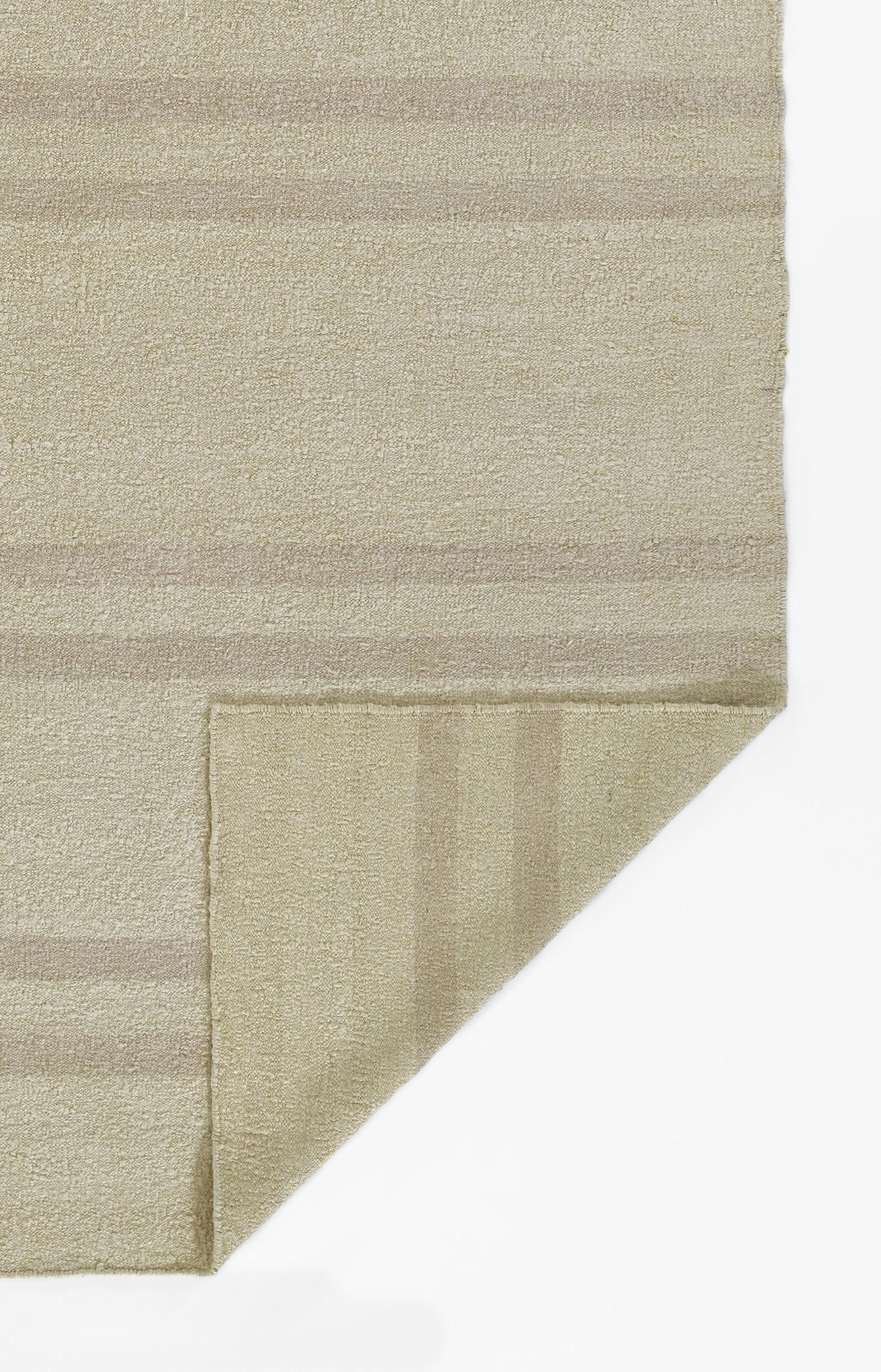 Beige textured rug with soft boucle pile and subtle cream stripes; 10' x 14' rug, folded corner reveals backing.