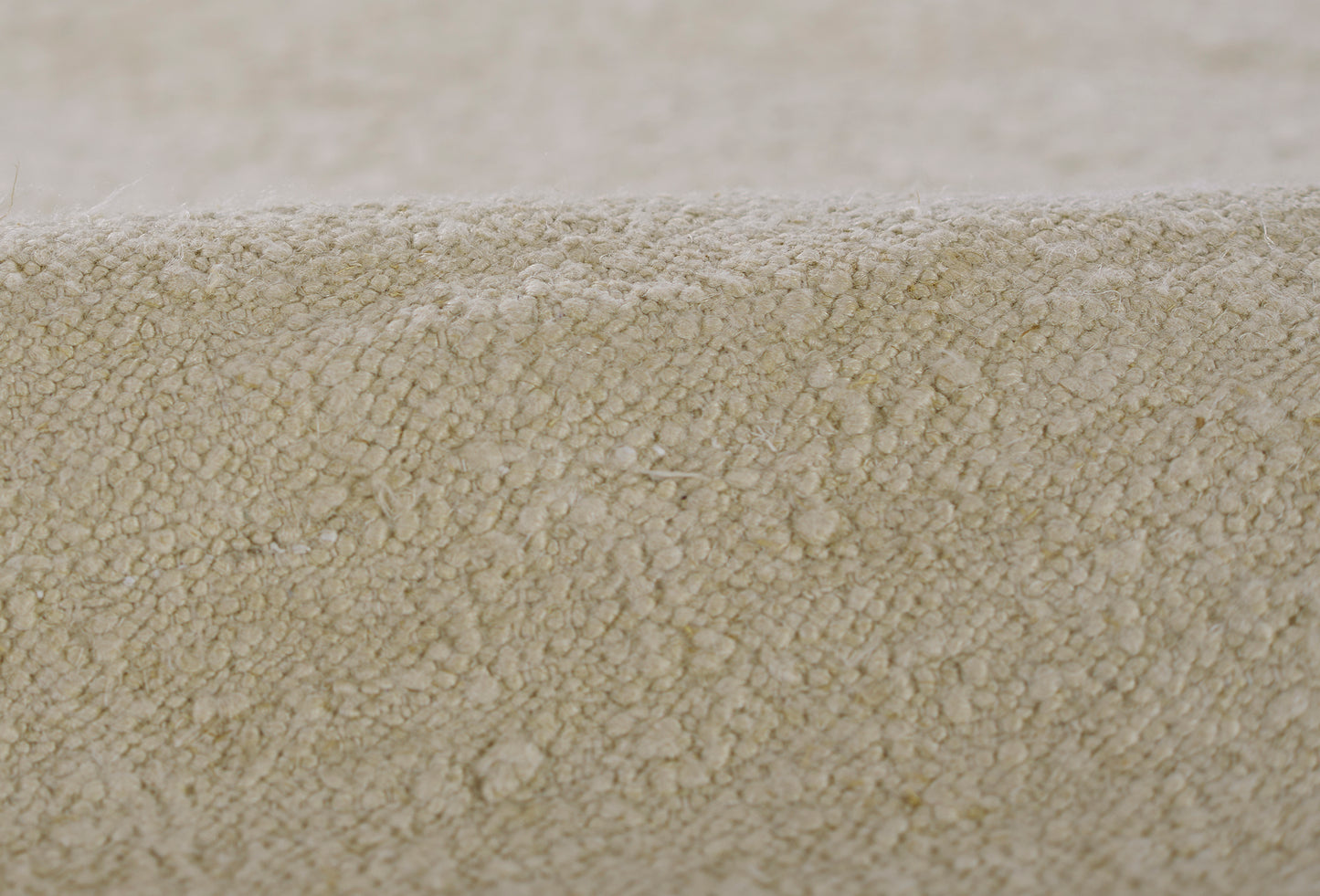 Beige textured loop-pile rug runner, soft neutral floor covering with plush dense fibers.