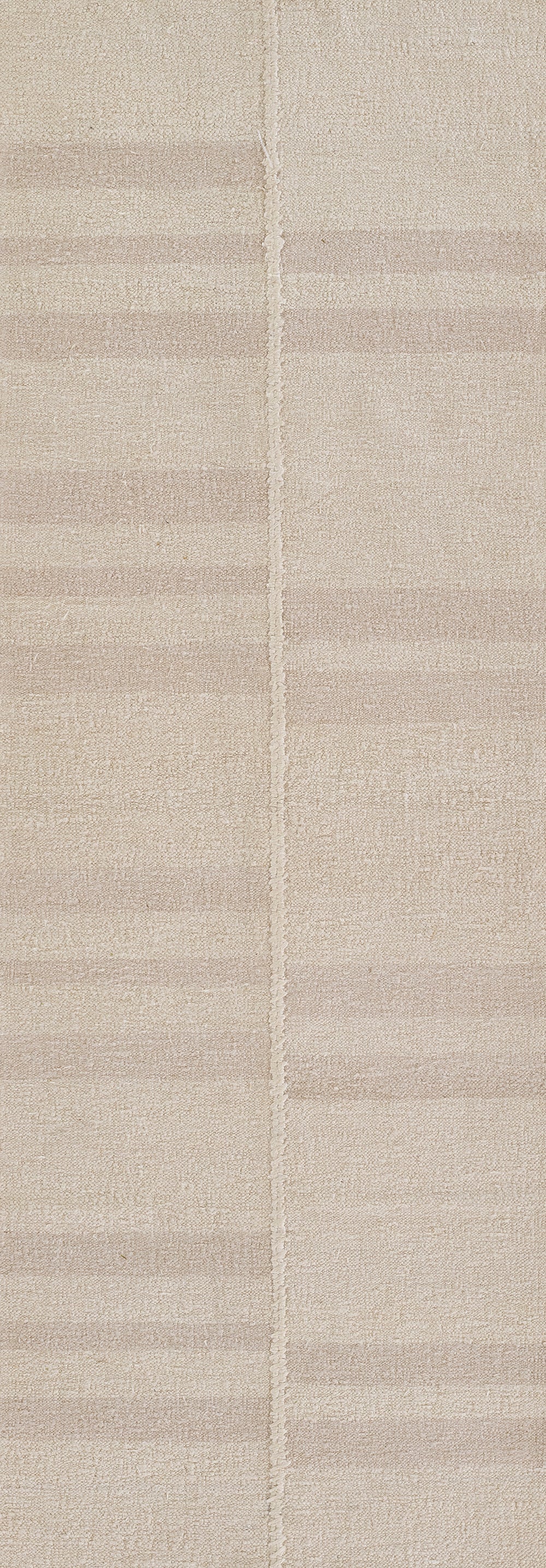 Ivory-beige textured woven rug with subtle horizontal stripes and a central seam; rectangular modern decor.