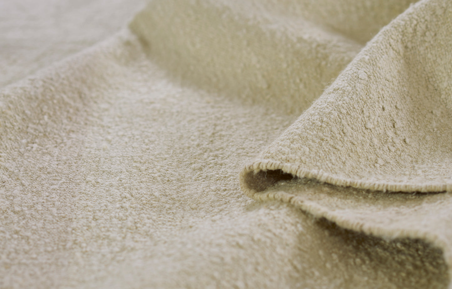 Muted Stripe rug runner in cream-beige tones with soft-loop pile and folded edge, 2'6" x 8'.