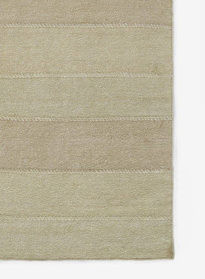 Beige rectangular plush rug with subtle horizontal stitched bands; soft dense pile for living room or bathroom.