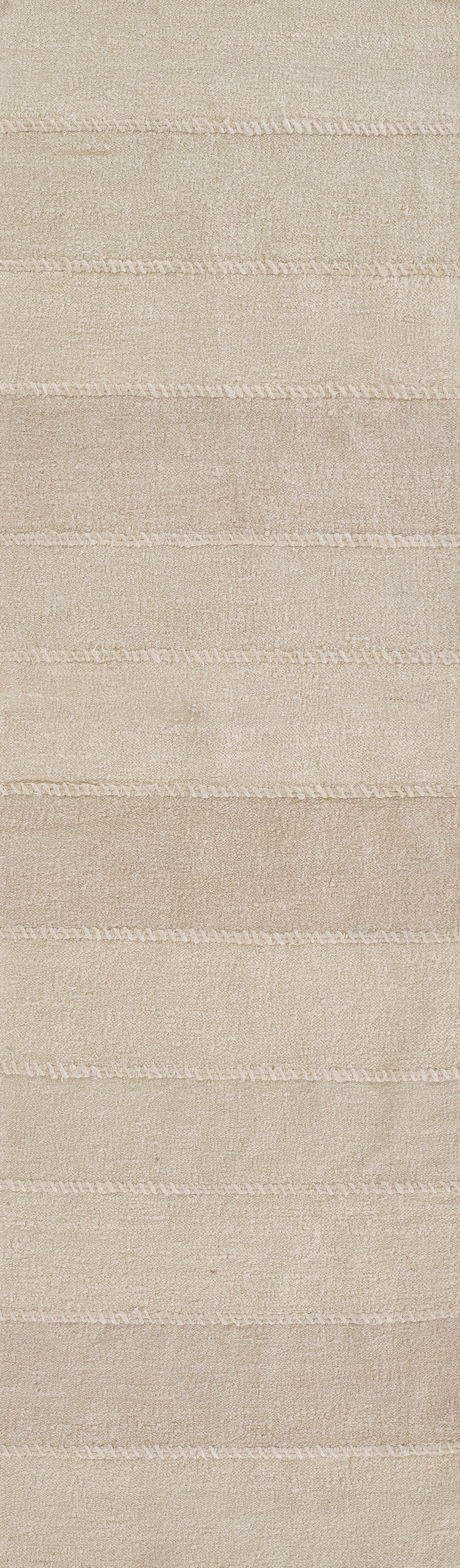 Beige woven rug with soft, textured surface and light horizontal stripe bands; ideal for living rooms.