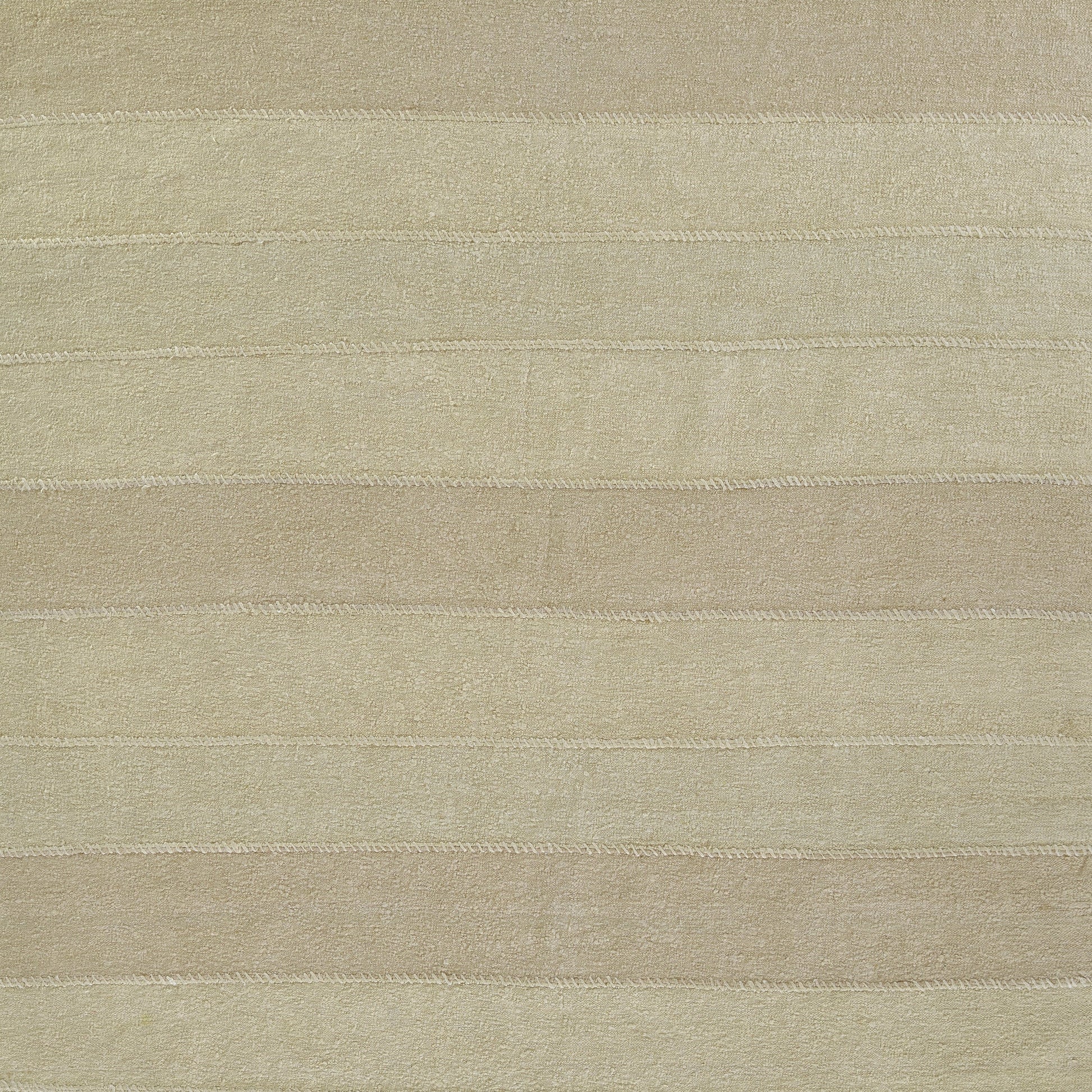 Beige striped plush rug with soft terry texture and subtle horizontal bands.