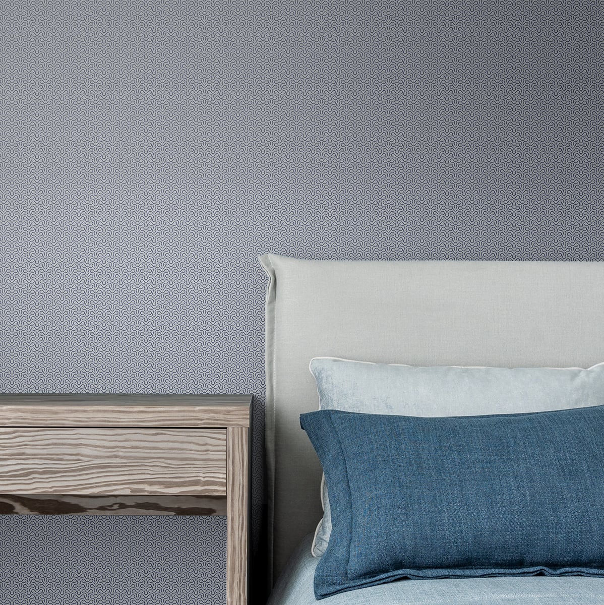 Blue matte geometric wall art in an art deco style with Mondrian-inspired spiro pattern; abstract blue shapes.