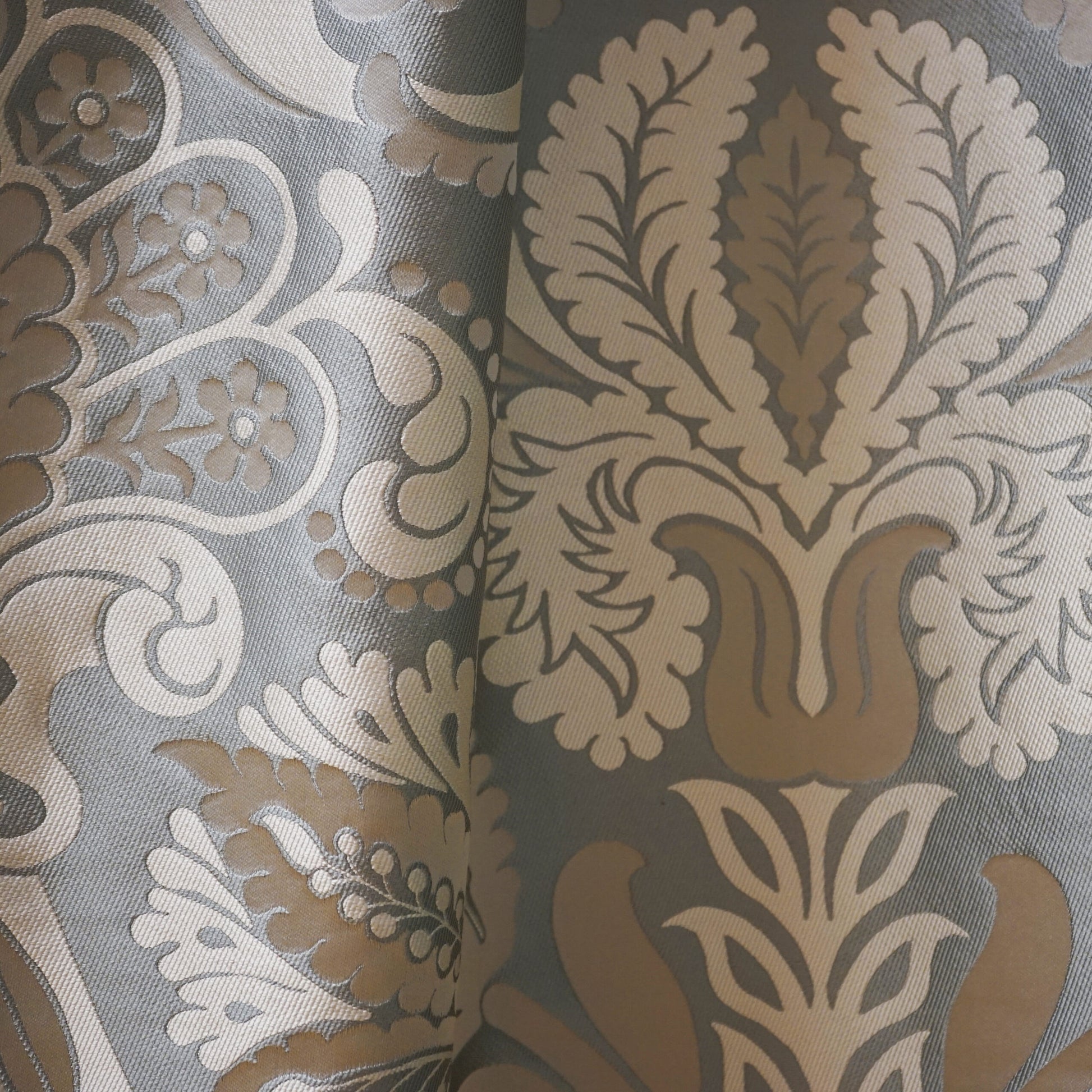 Silk jacquard fabric in a paisley pattern with blue, creme, beige, grey, silver and off-white tones; suitable for upholstery or drapery.