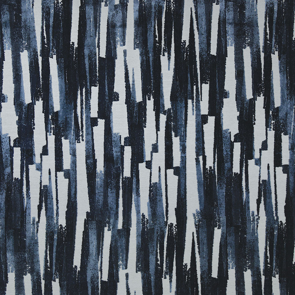 Abstract vertical brush-stroke pattern in navy blue, light blue and white on fabric.