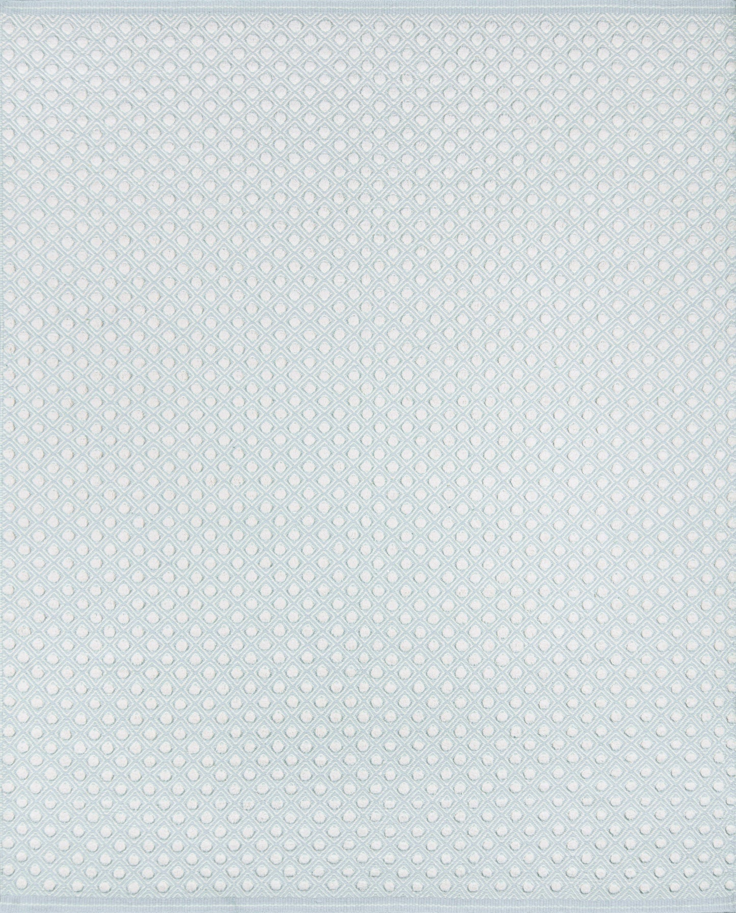 Light blue rug with a fine white dotted diamond lattice pattern.
