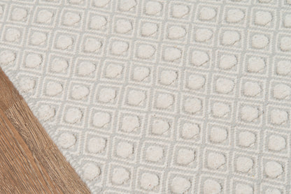 Gray geometric rug with raised square pattern, plush tufted texture, ideal for living rooms.