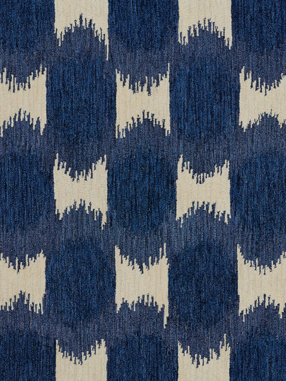 Navy blue and ivory geometric rug with ikat-inspired chevron motifs; woven floor textile for living spaces.