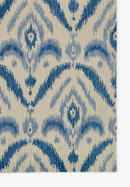 Beige rug with blue ikat pattern; woven texture and geometric motifs for living room decor.