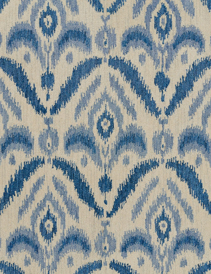Blue & cream ikat-inspired textile featuring repeating diamond & chevron motifs, woven fabric for rug or drapery.