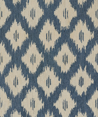 Blue background with beige diamond ikat pattern; woven rug fabric.