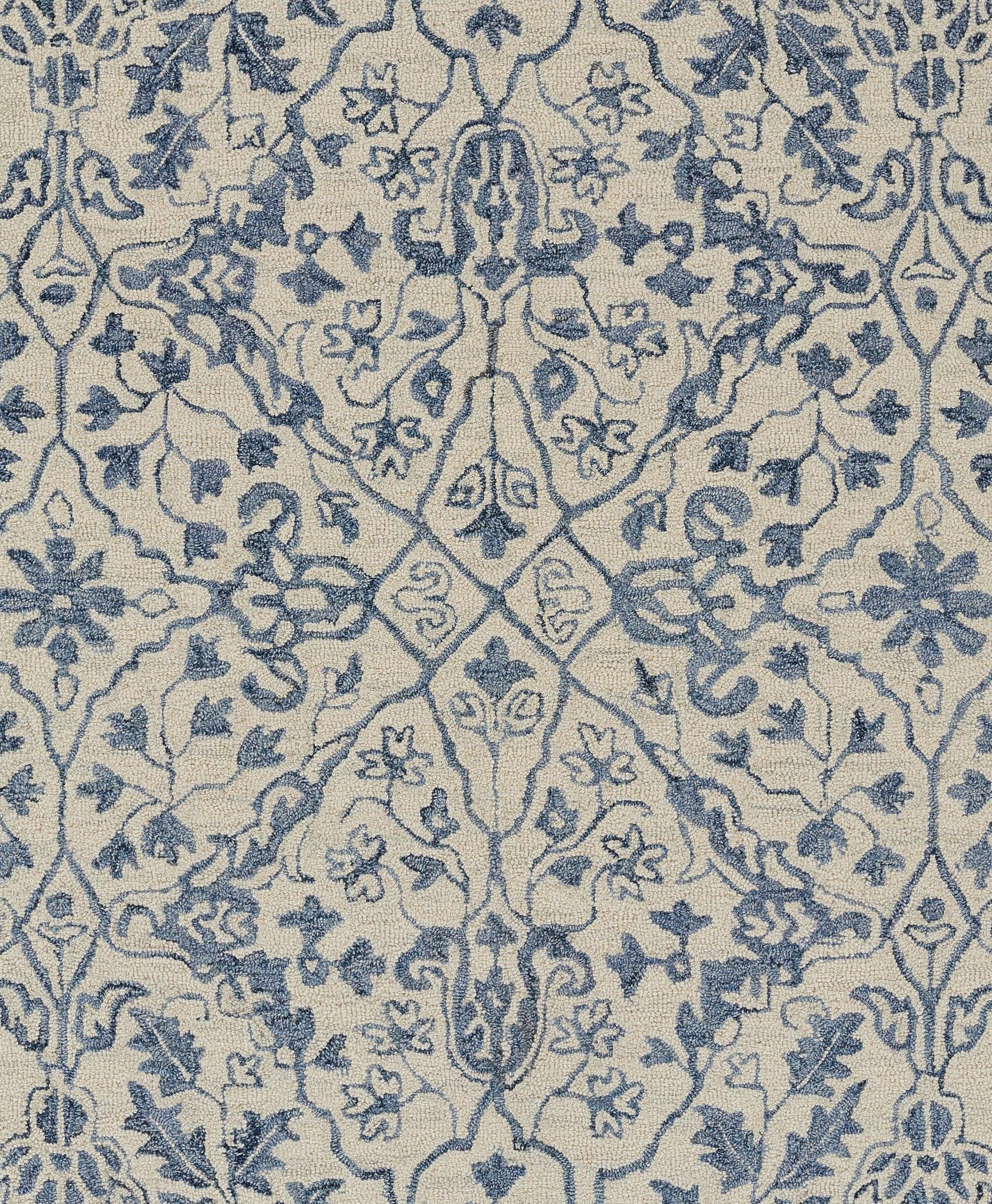 Blue damask pattern on cream background runner rug; ornate floral motifs, woven textile.