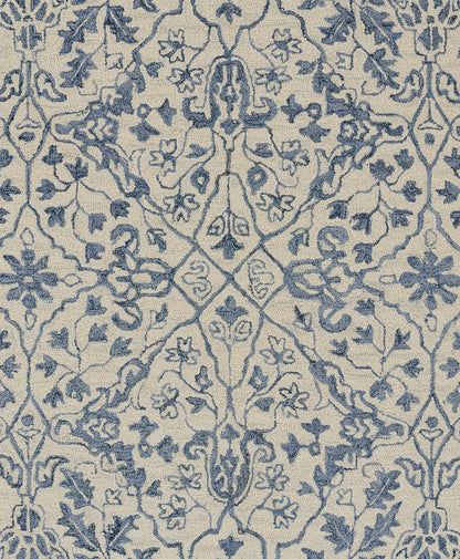 Blue damask pattern on cream background runner rug; ornate floral motifs, woven textile.