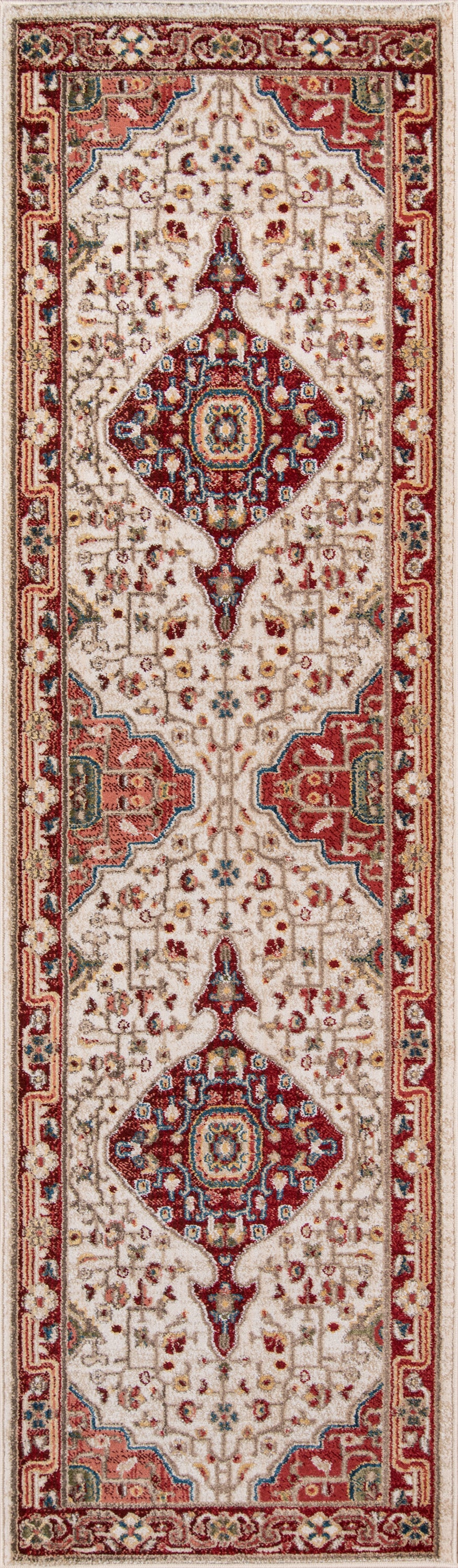 Oriental runner rug with ivory field, red diamond medallions and floral border; warm red, cream, and navy tones.