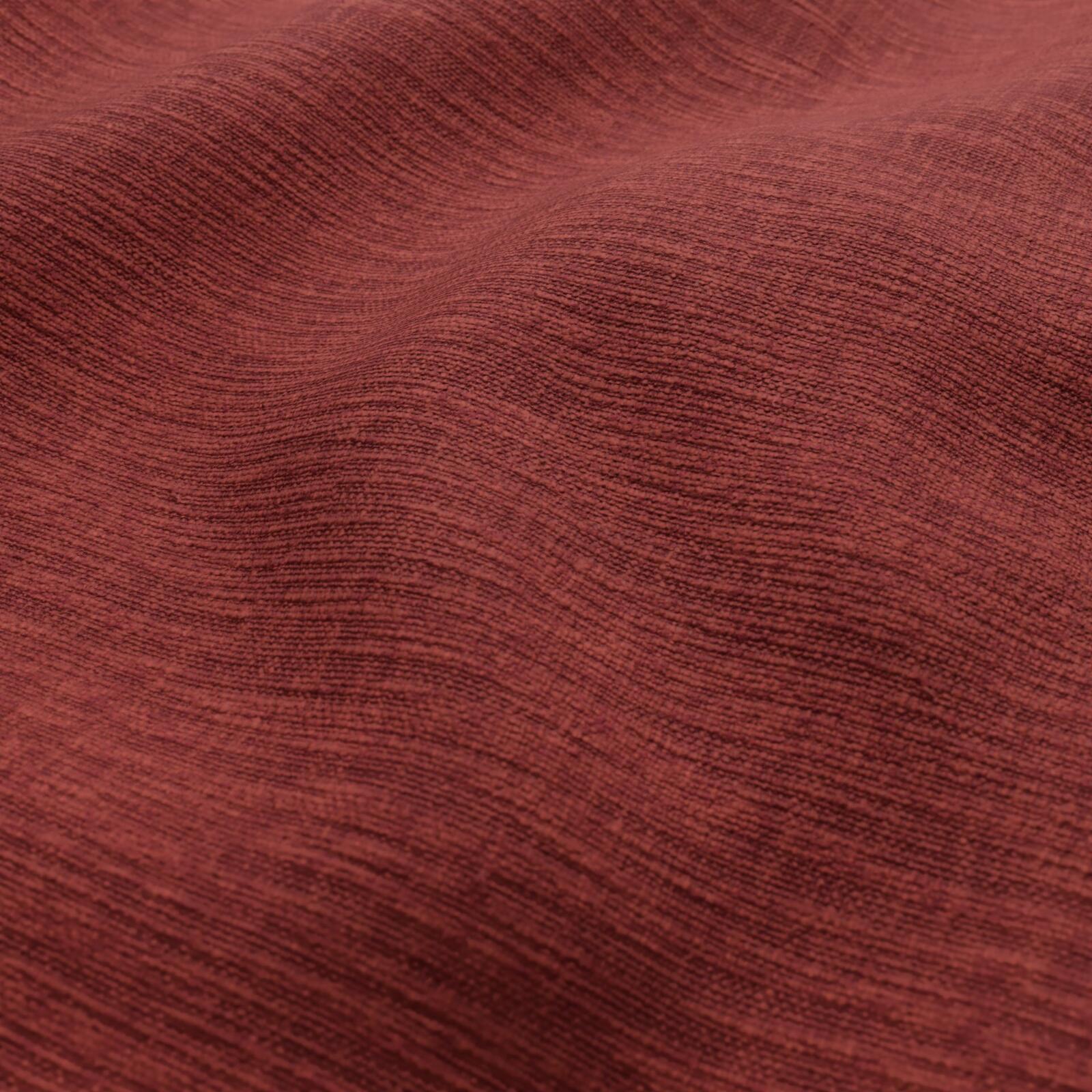 Rust-red woven fabric with a subtle plain weave texture and soft drape.