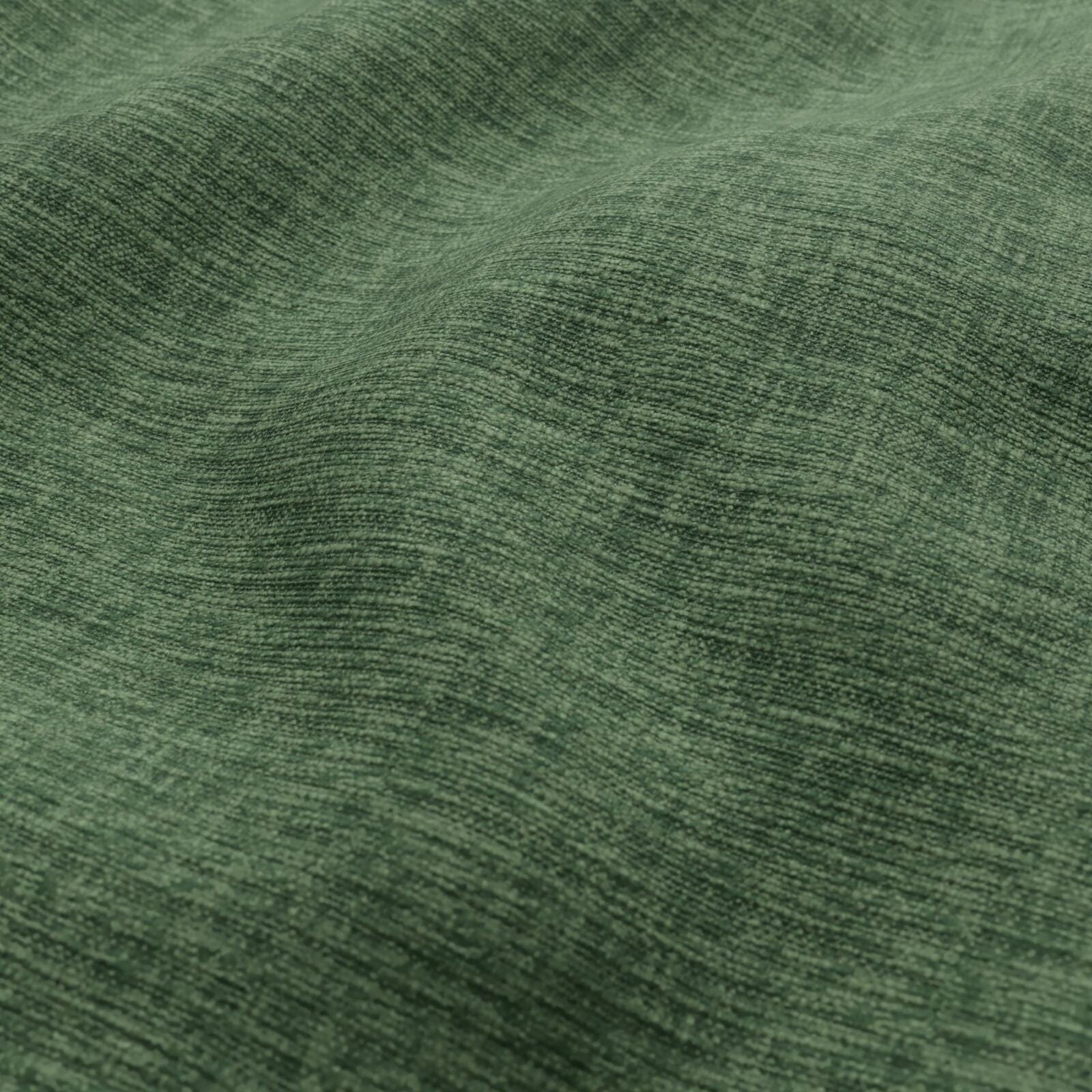 Close-up of emerald green heathered woven fabric with soft folds.