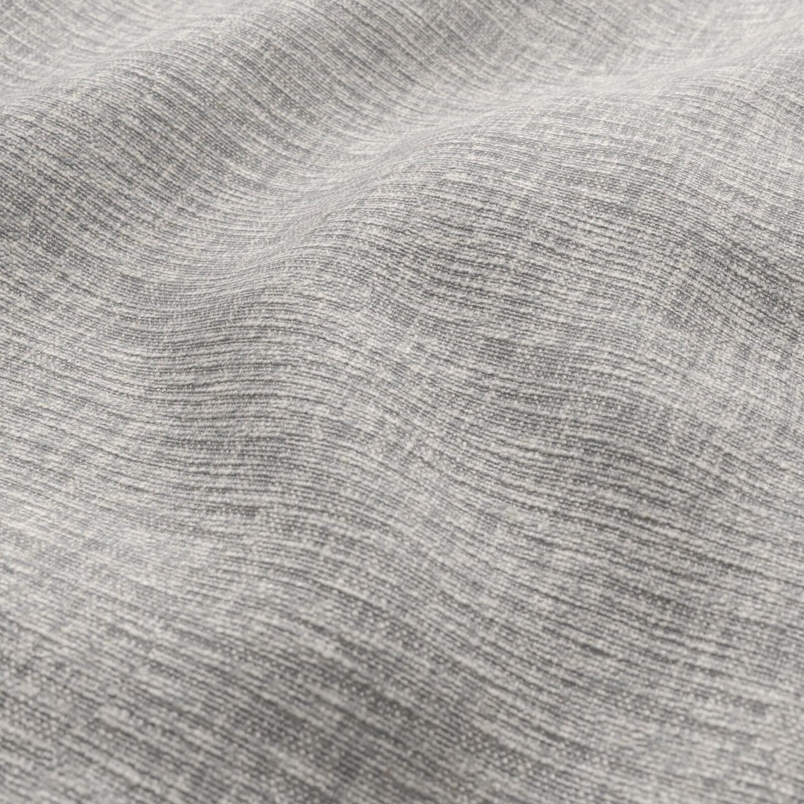 Close-up of heather gray woven fabric with soft, wavy texture and folds.
