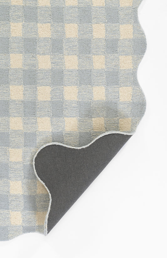 Light blue and cream gingham cotton fabric swatch with curved edge and white stitched border; dark grey backing.