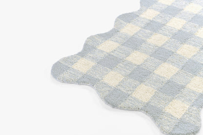 Light blue and cream gingham rug with scalloped edge; soft plush fabric for bathroom or bedroom decor.