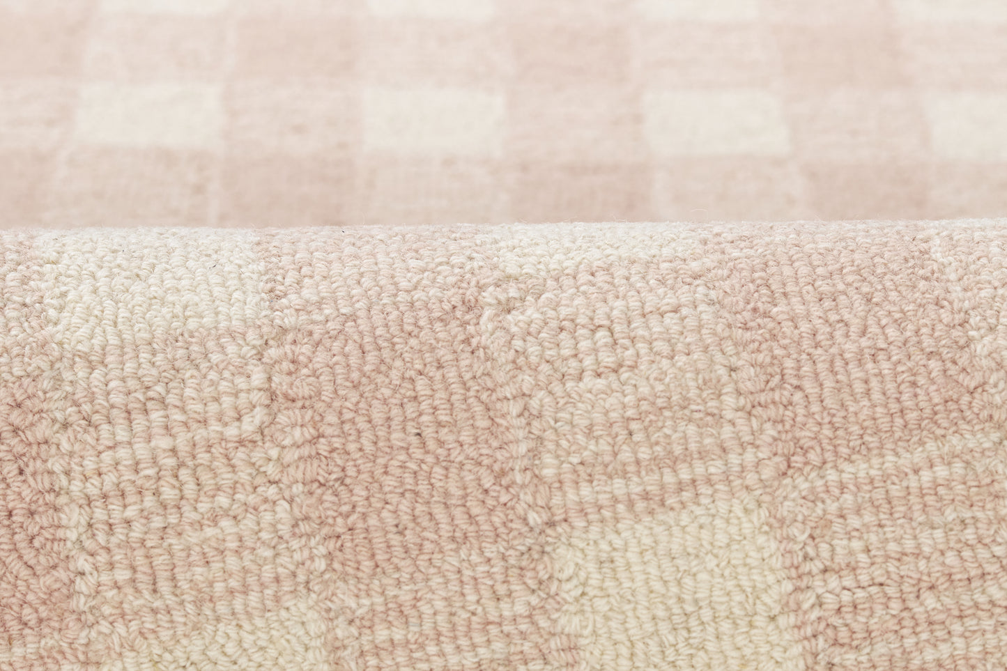 Pastel pink and cream checkered chenille rug runner; plush texture.