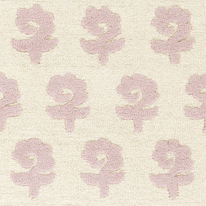 Beige textured rug with repeating soft pink lily-like flower motifs.