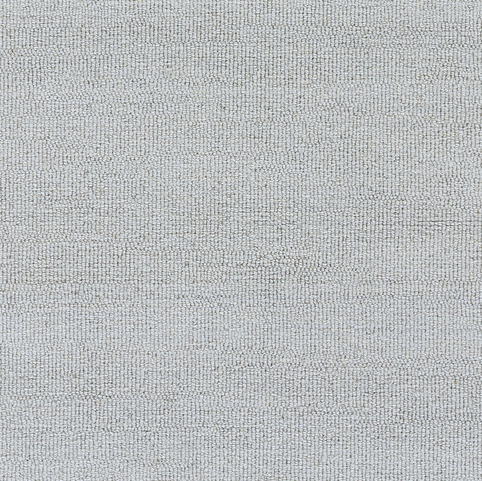 Close-up of light bluish-gray textured rug with a tight woven pattern.