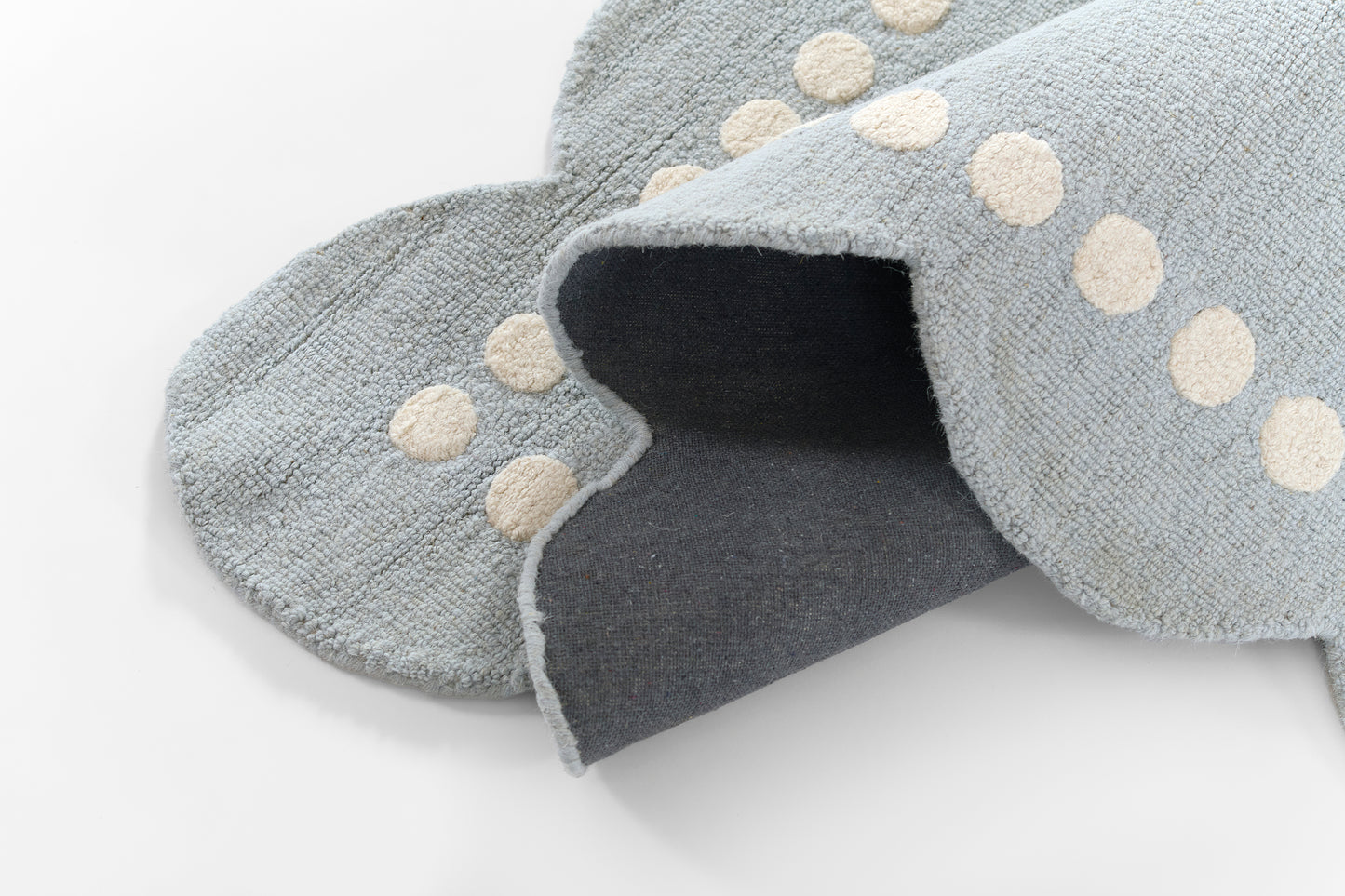 Blue-gray rug runner (2' x 8') with cream polka-dot trim and soft terry texture for cozy decor.