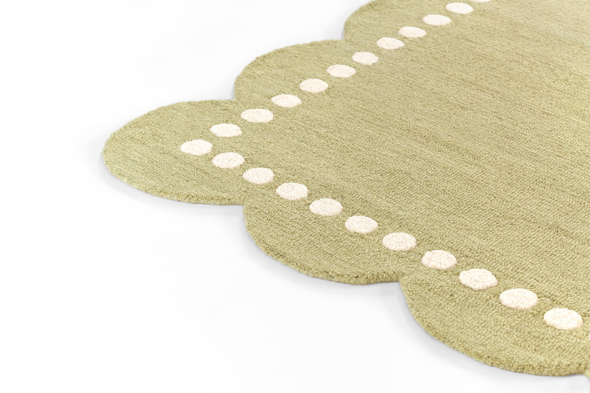 Natural beige scalloped placemat with white dotted border and woven texture.