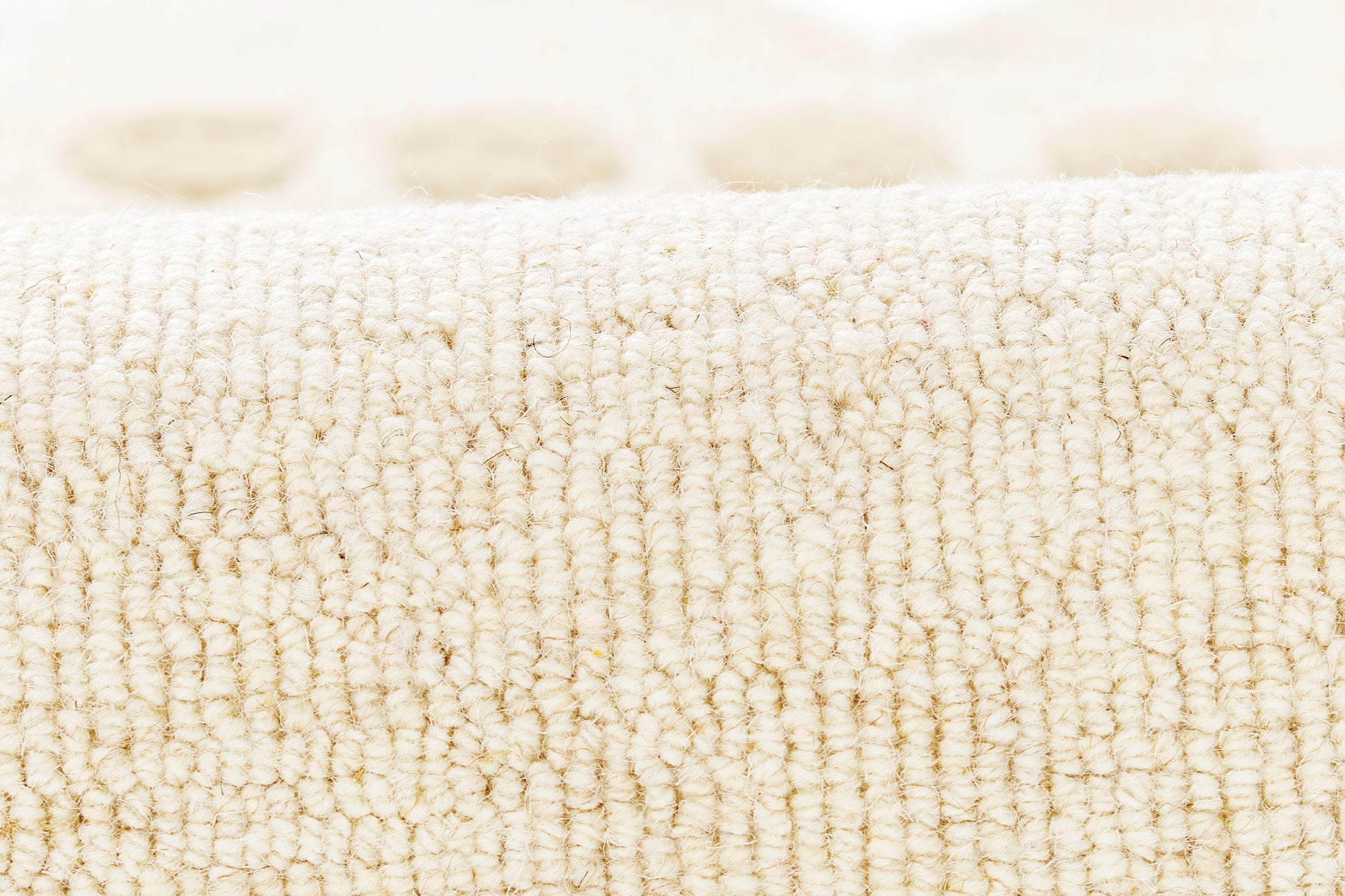 Beige terry cloth towel close-up; plush cotton loops, soft absorbent bath towel.
