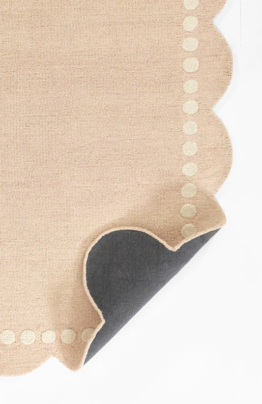Beige linen napkin with scalloped edge and dotted border, rustic chic table decor.