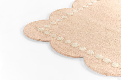 Soft pink scalloped rug with a white dotted border; plush microfiber, 5' x 8'.