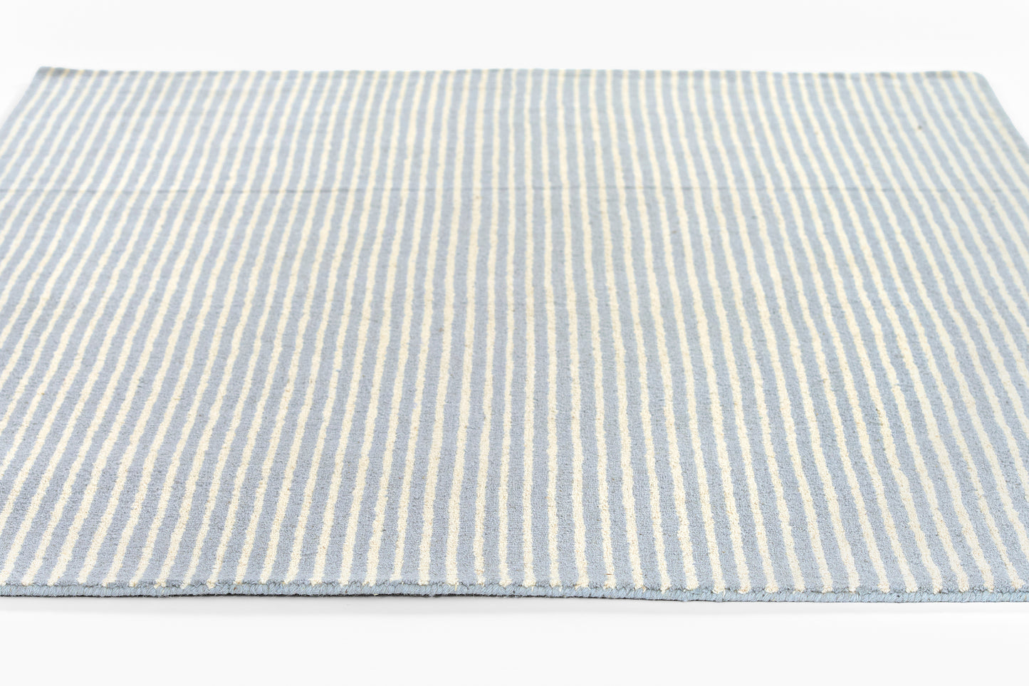 Blue & white striped woven rug, rectangular flatweave, coastal home decor.