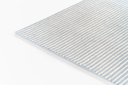 Rectangular light-blue and white striped woven rug for home decor.