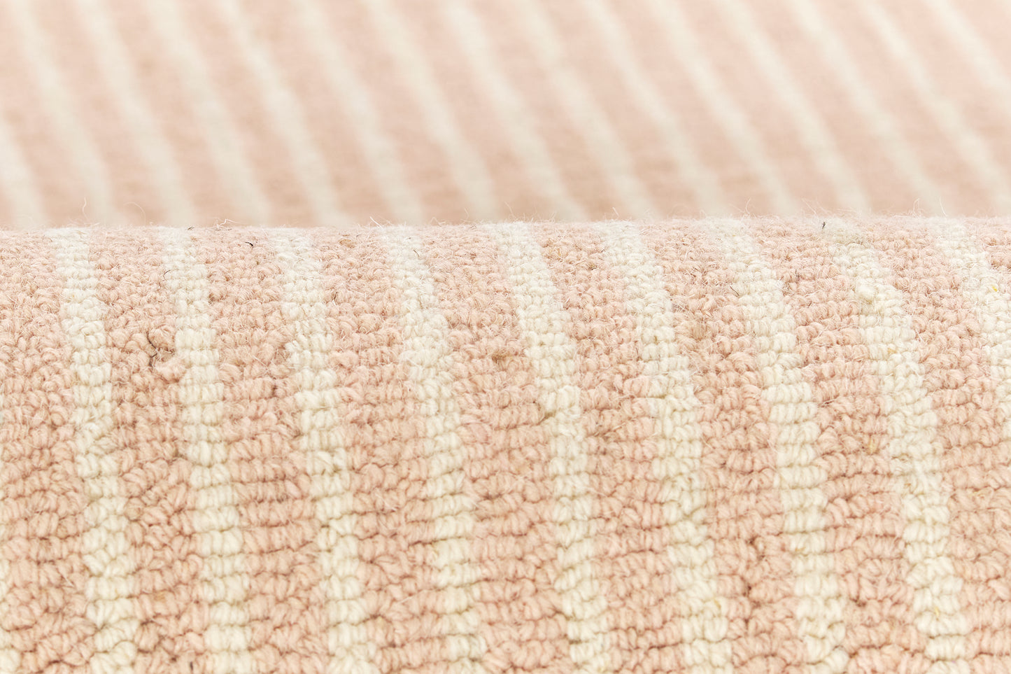 Peach & cream striped rug with terry cloth texture and plush loops.