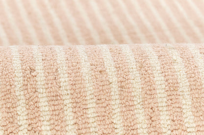 Peach & cream striped rug with terry cloth texture and plush loops.