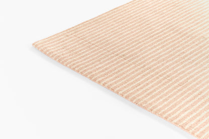 Peach and white striped linen napkin, rectangular table textile with a soft, lightweight look.