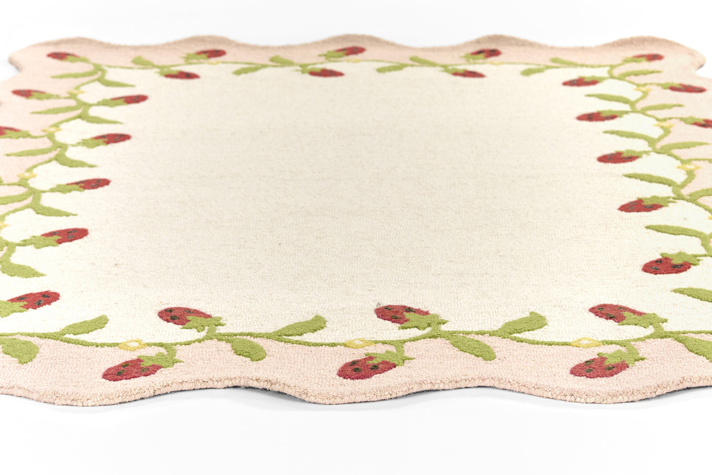 Cream rectangular 2' x 8' runner rug with scalloped edges and a green berry vine border.