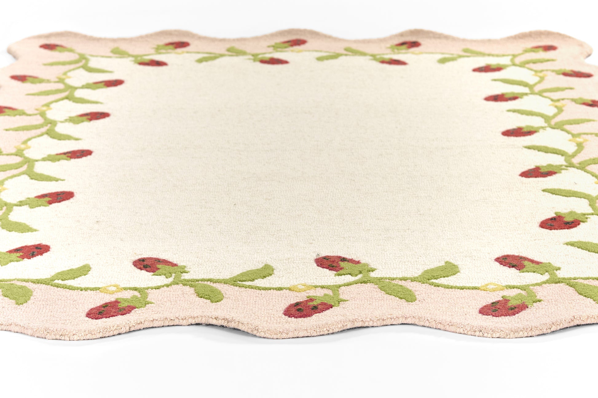 Cream rectangular 2' x 8' runner rug with scalloped edges and a green berry vine border.